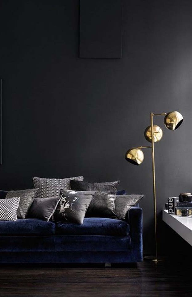 The deep cobalt and brass accent pieces complete this moody room.