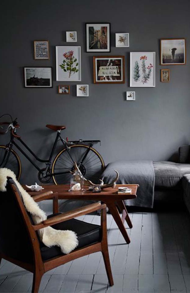 This dark space with mid-century accents is a great example of a dark, small living room.