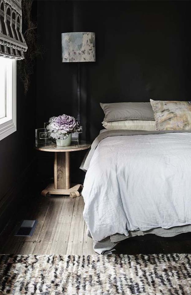The mix of dark and light really works in this room. The awesome textiles mixed in give this room some life.