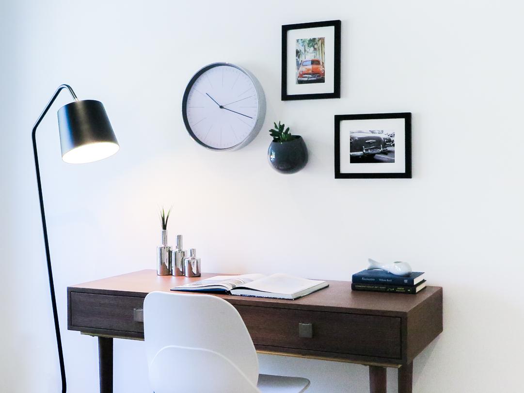 home office gallery wall with white office chair and wall planter