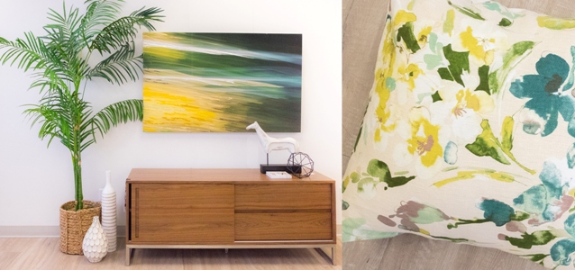 sideboard withyellow and green art and pillow