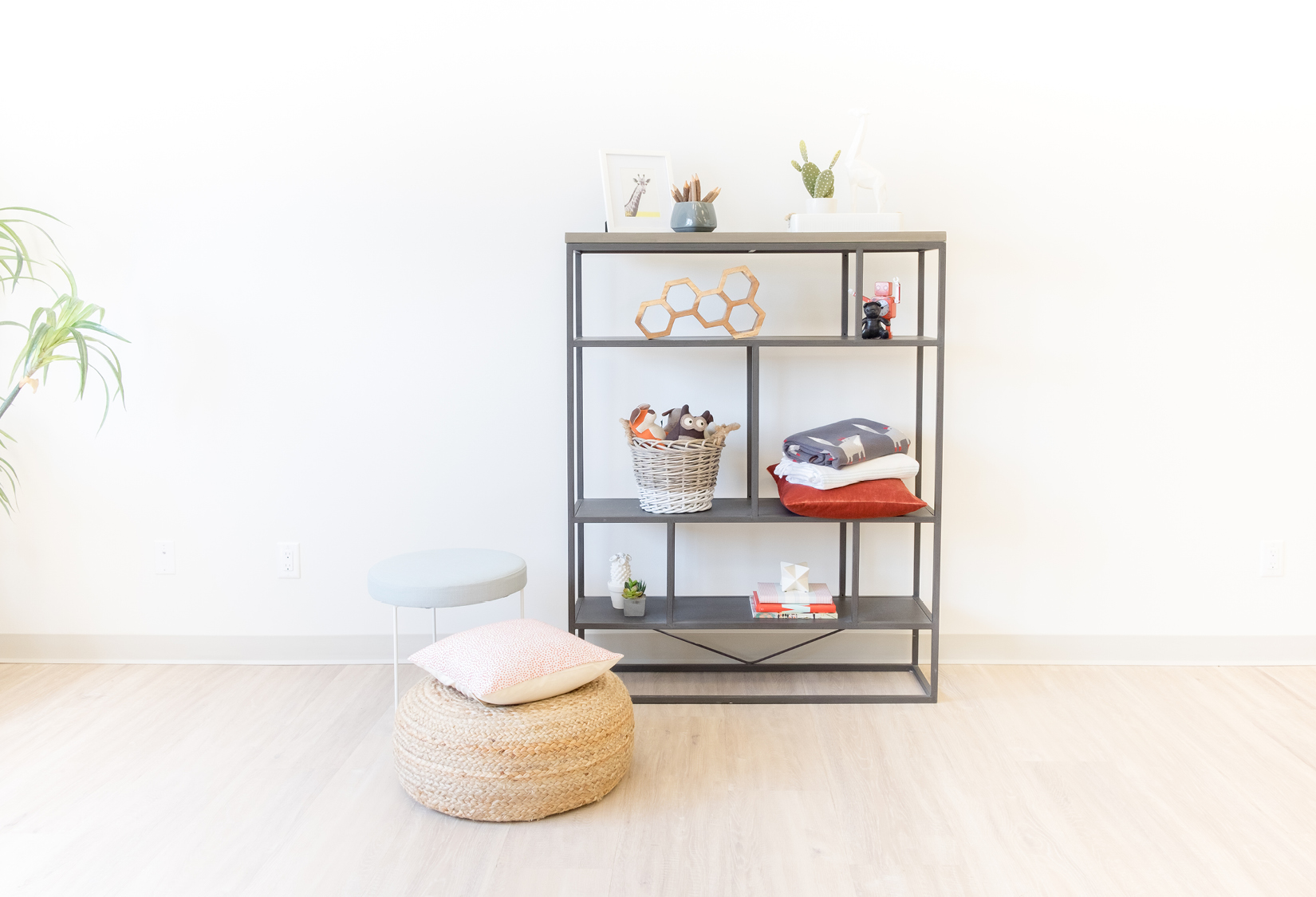kids room book shelf styled with orange accessories