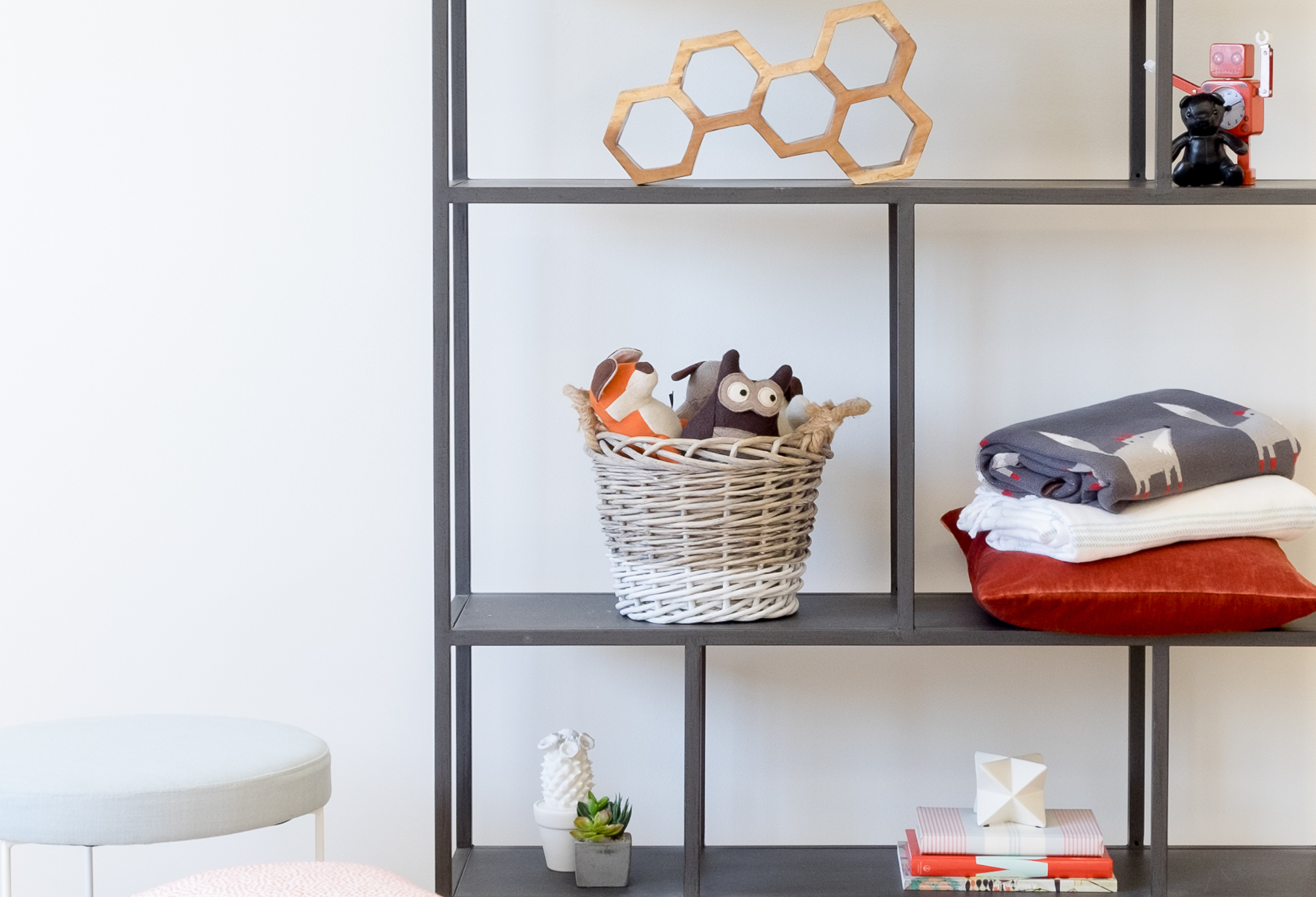 kids room book shelf styled with orange accessories